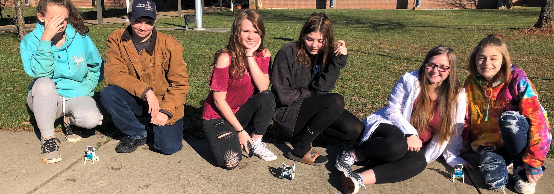 students with solar powered robots