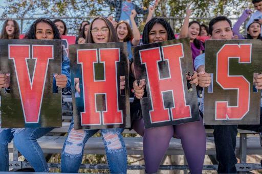 students holding VHHS signs