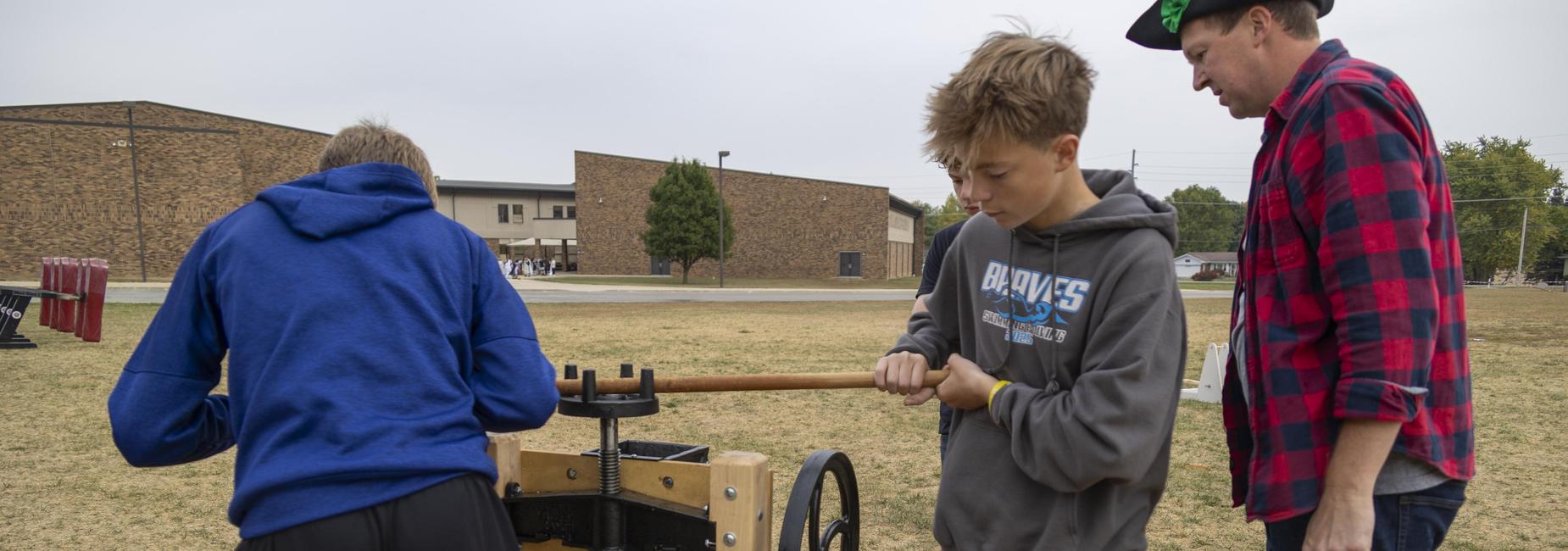 Students working on equipment.