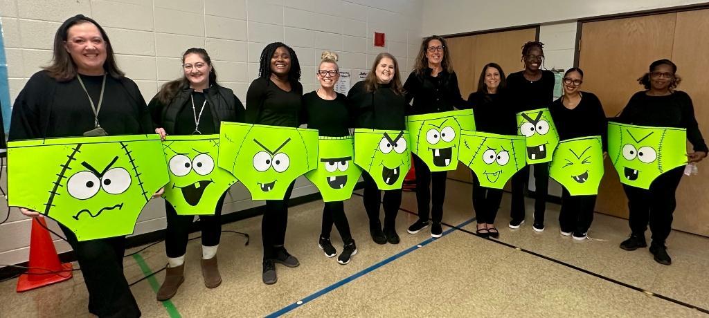 10 teachers dressed sport cardboard neon green underwear