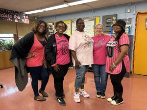 Staff in pink shirts and breast cancer tshirt