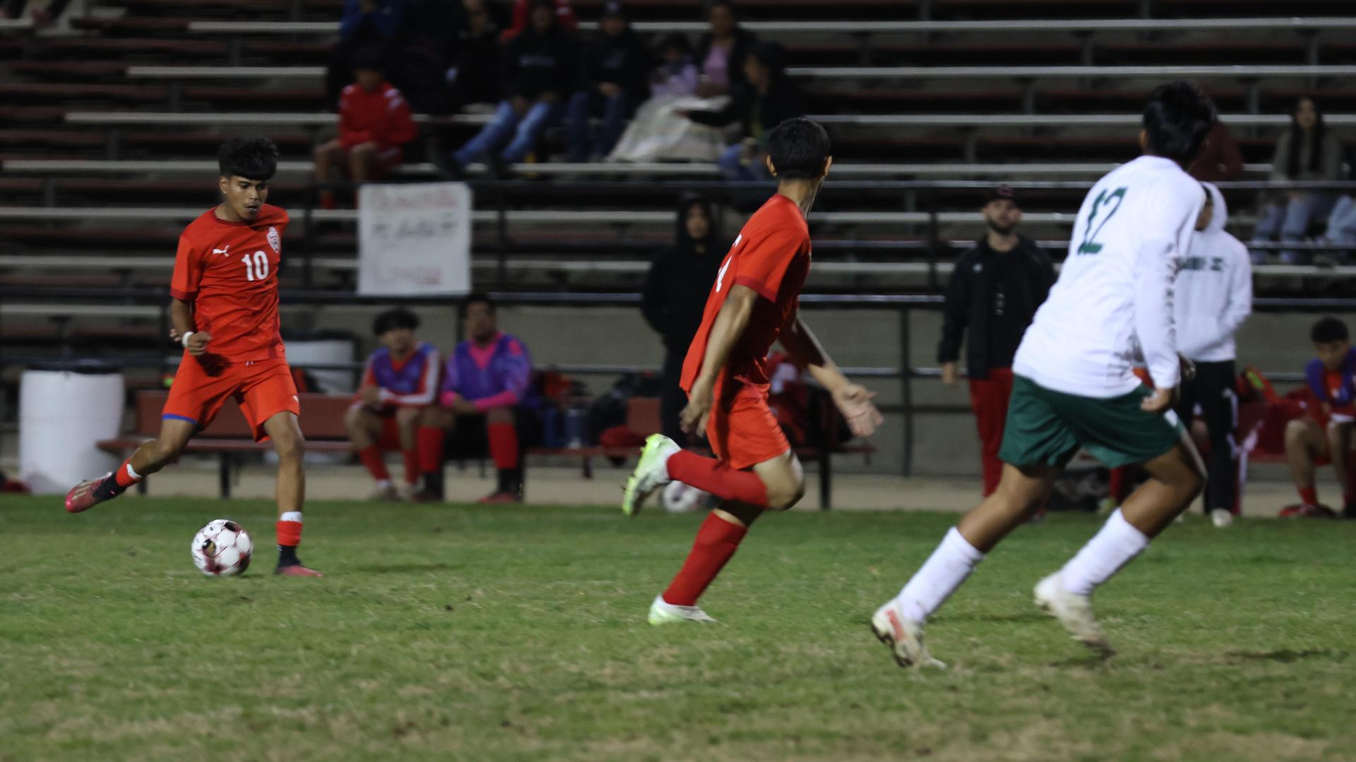 Varsity boys play soccer against Kingsburg