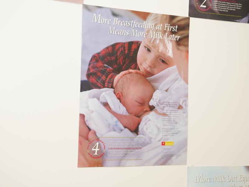 The wall of the clinic with a photo of a mom and infant together