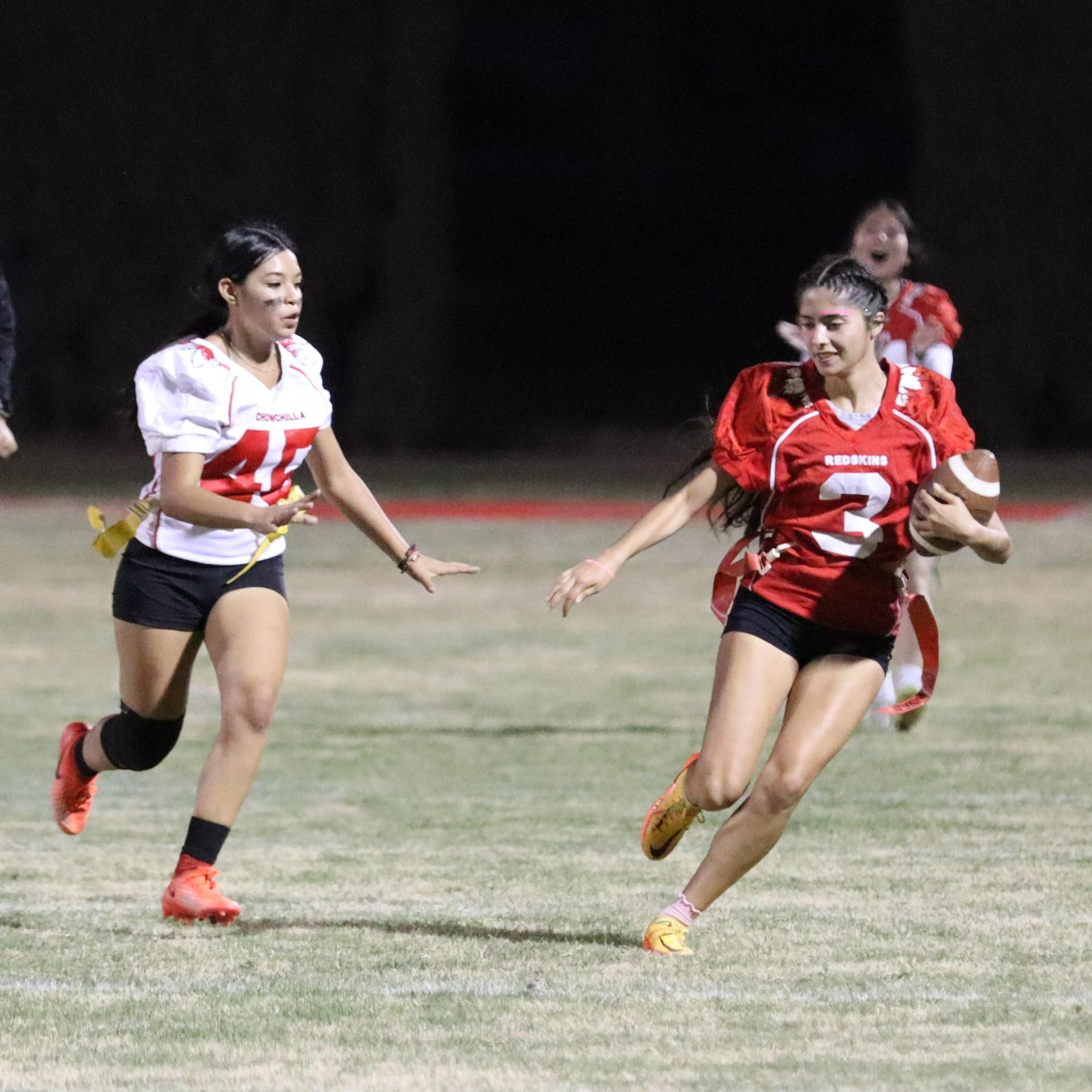 girls playing flag football