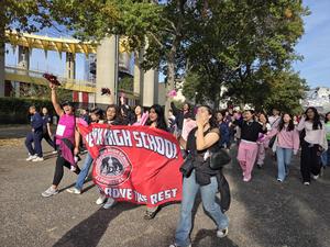 walking with the banner for breast cancer awarness