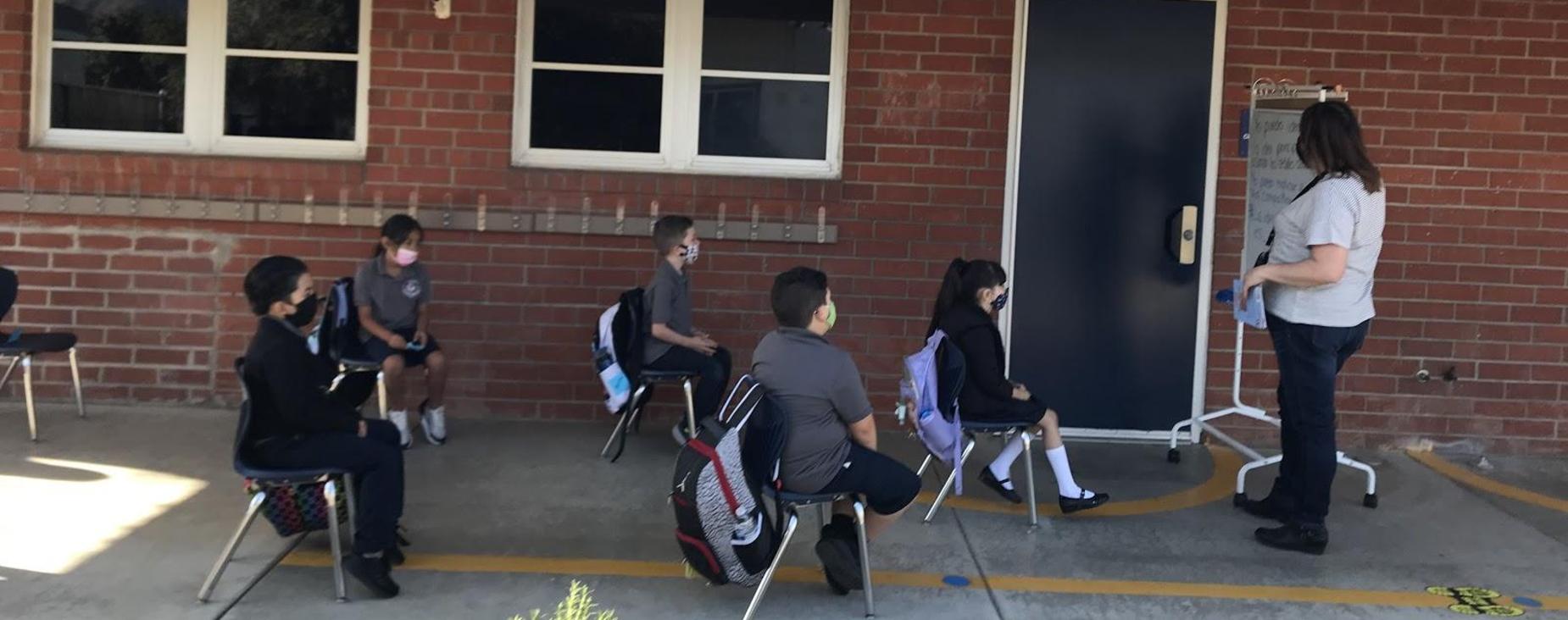 Teacher outside with students