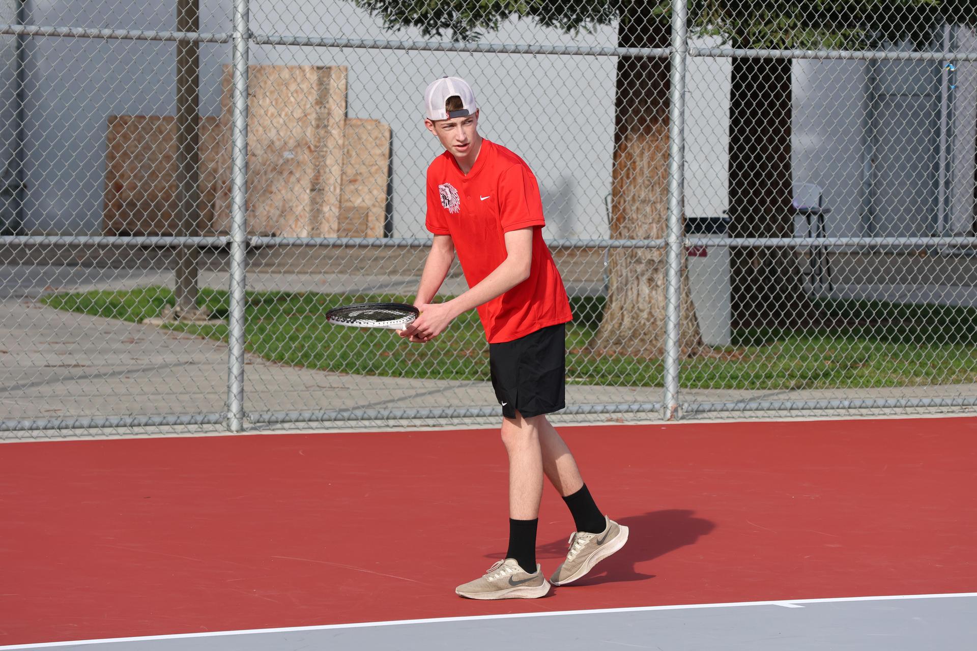 CUHS Boys playing tennis against coalinga