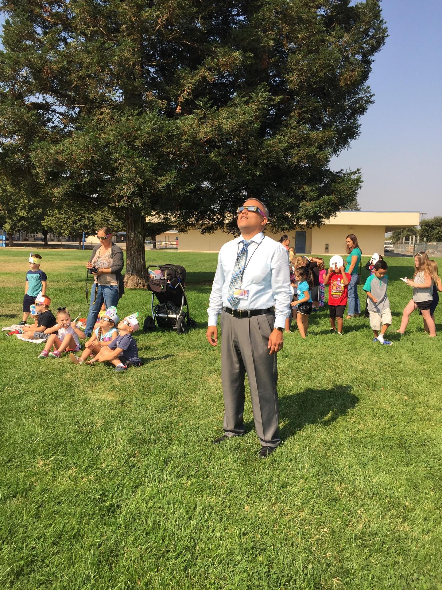 Mr. Zambrano viewing an eclipse