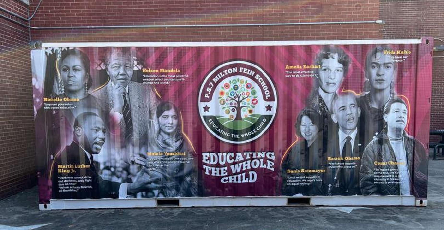 A mural featuring notable figures around the theme "Educating the Whole Child."