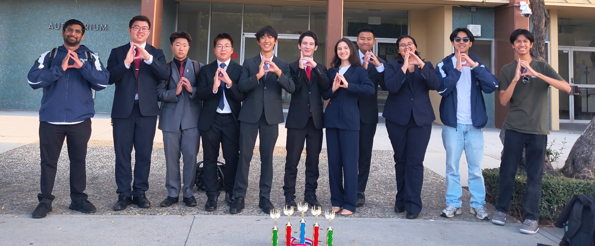 Debate students with their awards