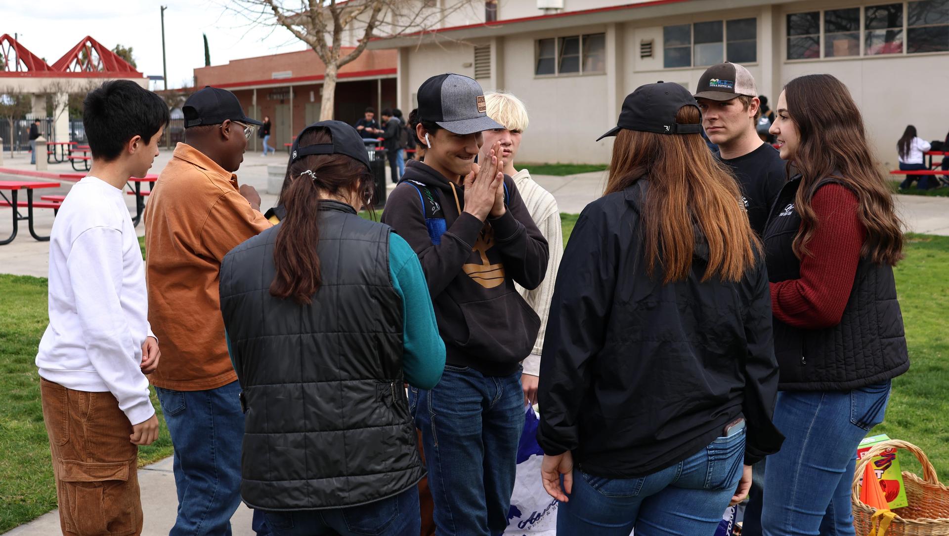 students and staff enjoying the feed bag relay