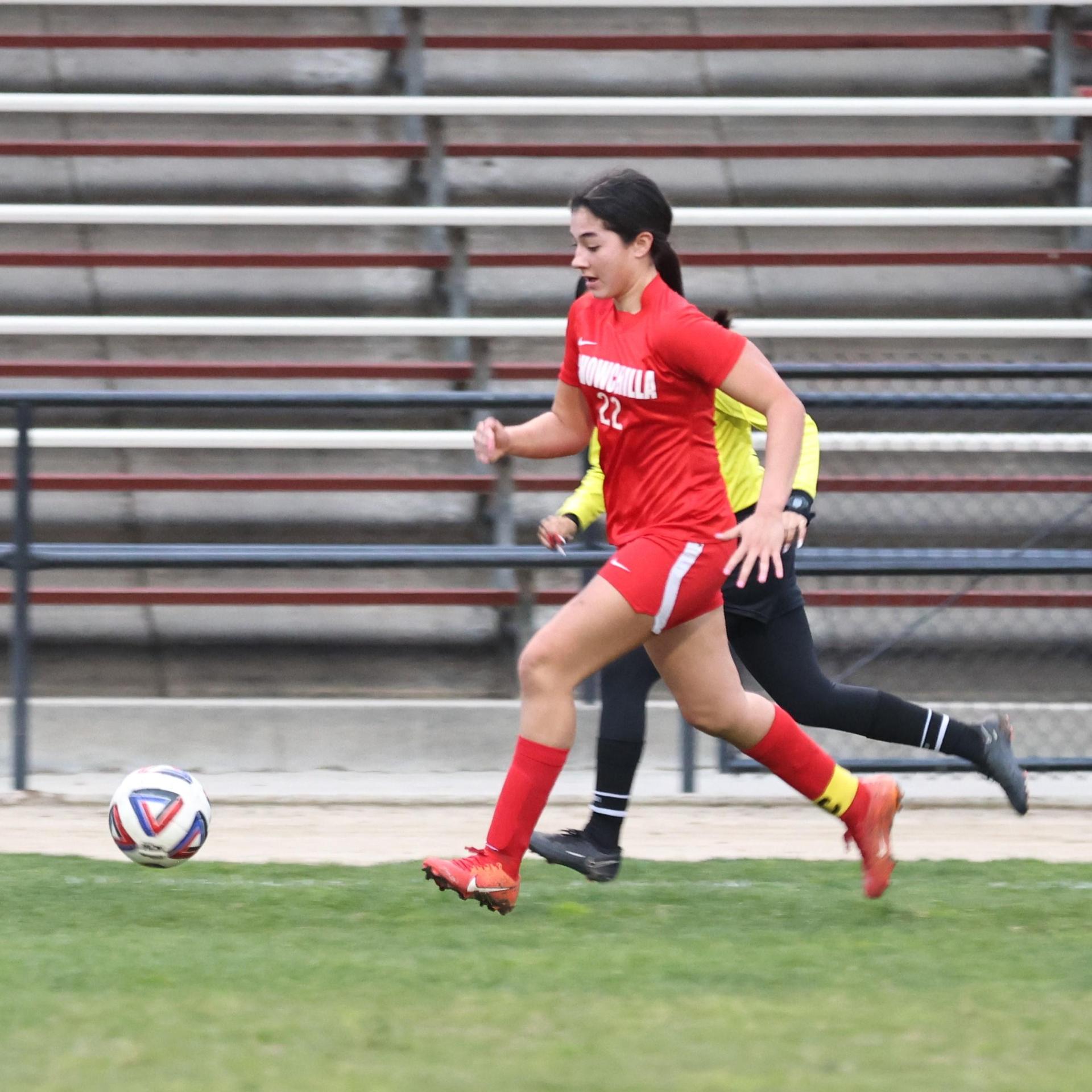 Junior varsity girls playing soccer against liberty