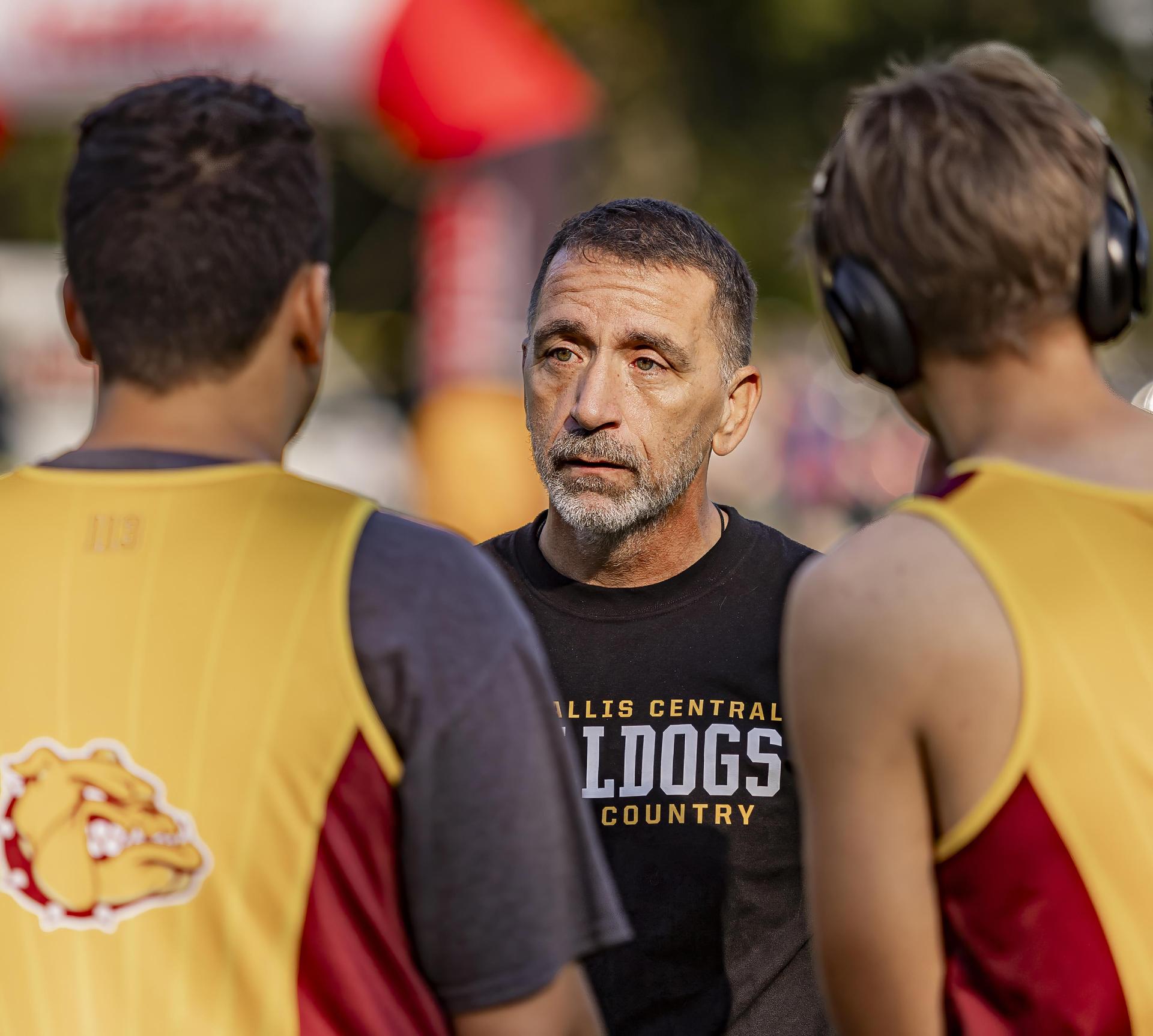 Coach talking to runners
