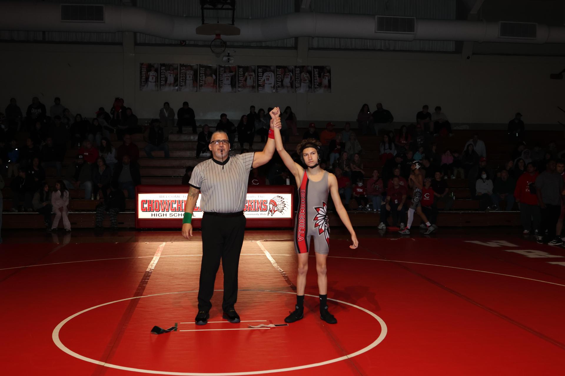 Wrestling winners with hands up 20