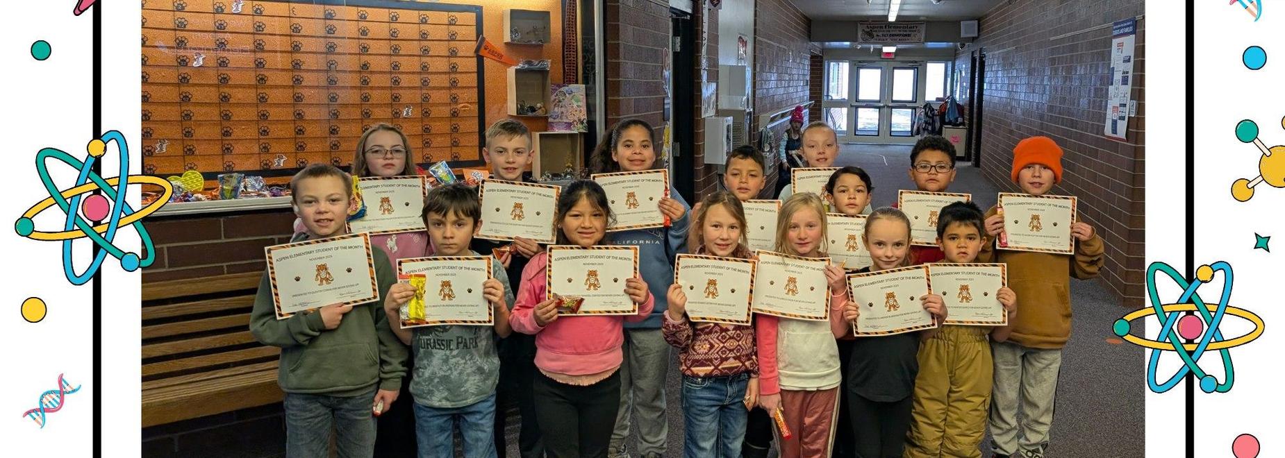 A classroom hallway filled with students holding certificates.