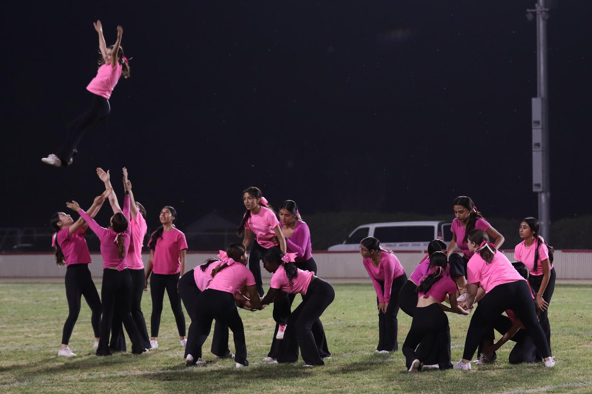 Varsity Cheer performing at halftime vs. Fowler