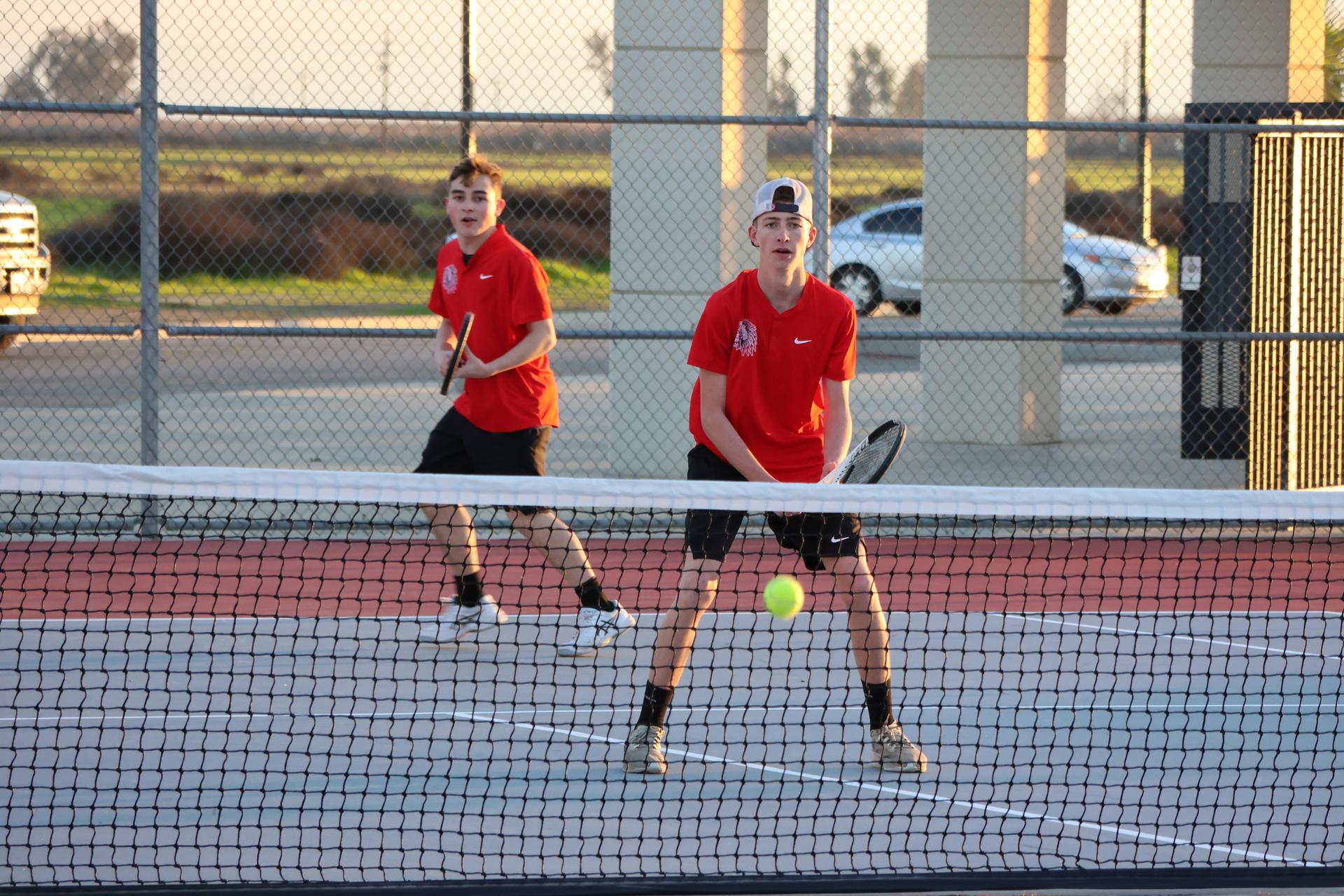 CUHS Boys playing tennis against coalinga