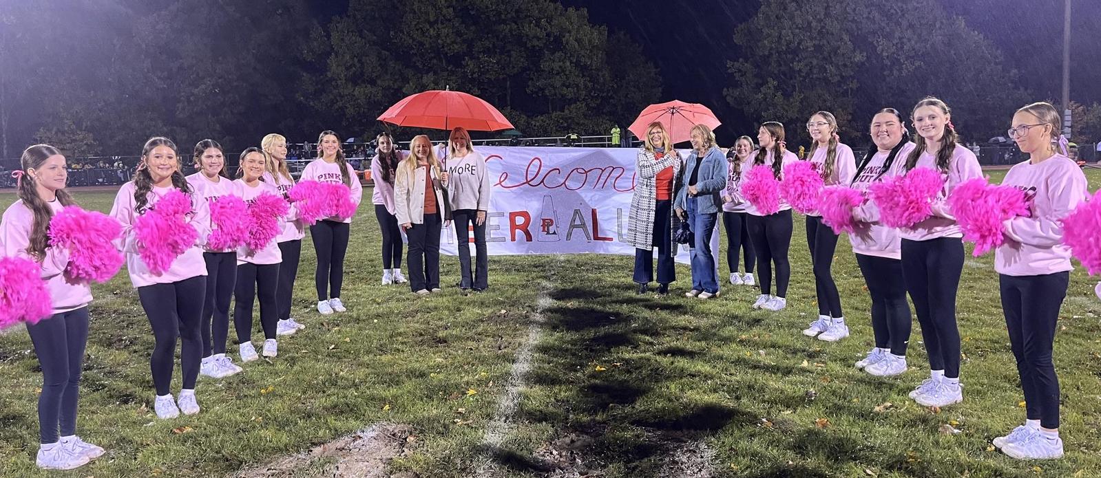 Alumni Night Cheerleading recognition. Four alumni with the current cheerleaders.