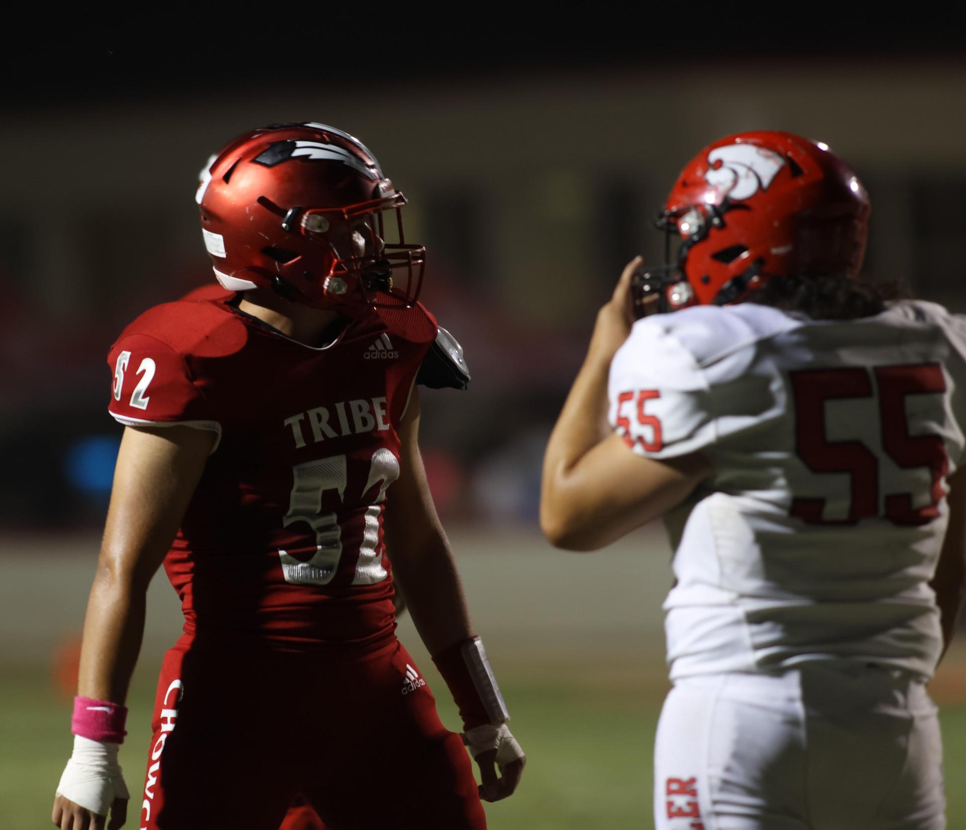 varsity boys playing football against Fowler