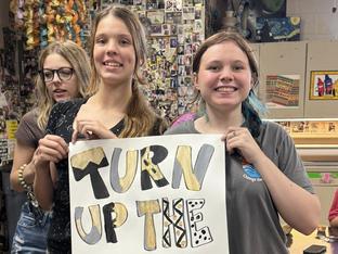 Students with sign