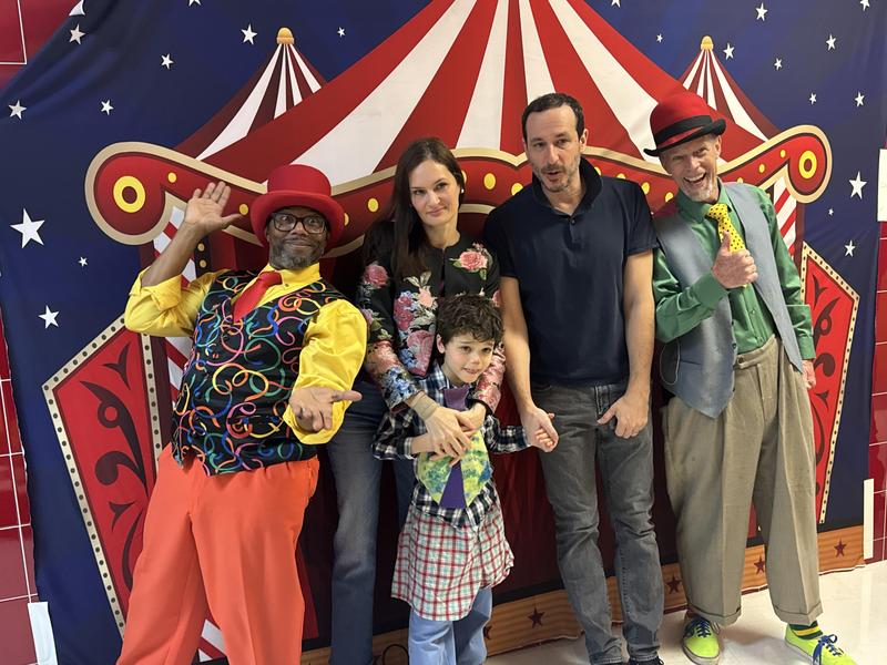Student and family in front of circus photo