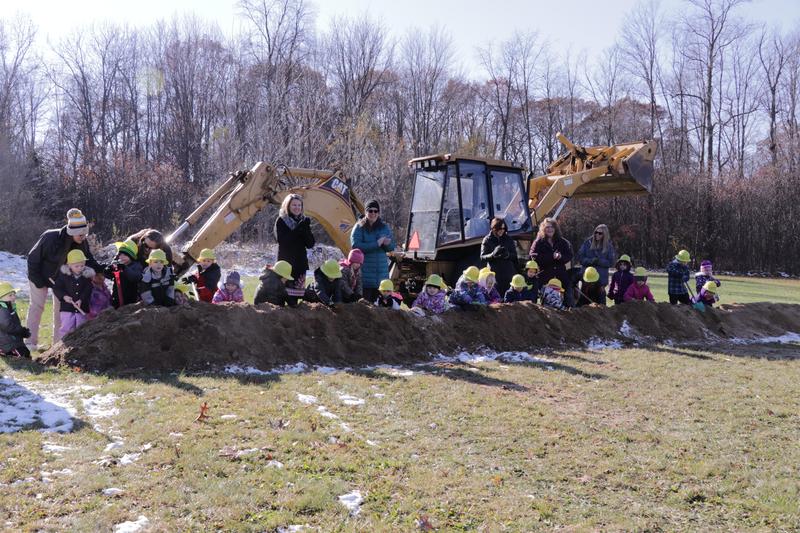 preschooler dig in the groundbreaking.