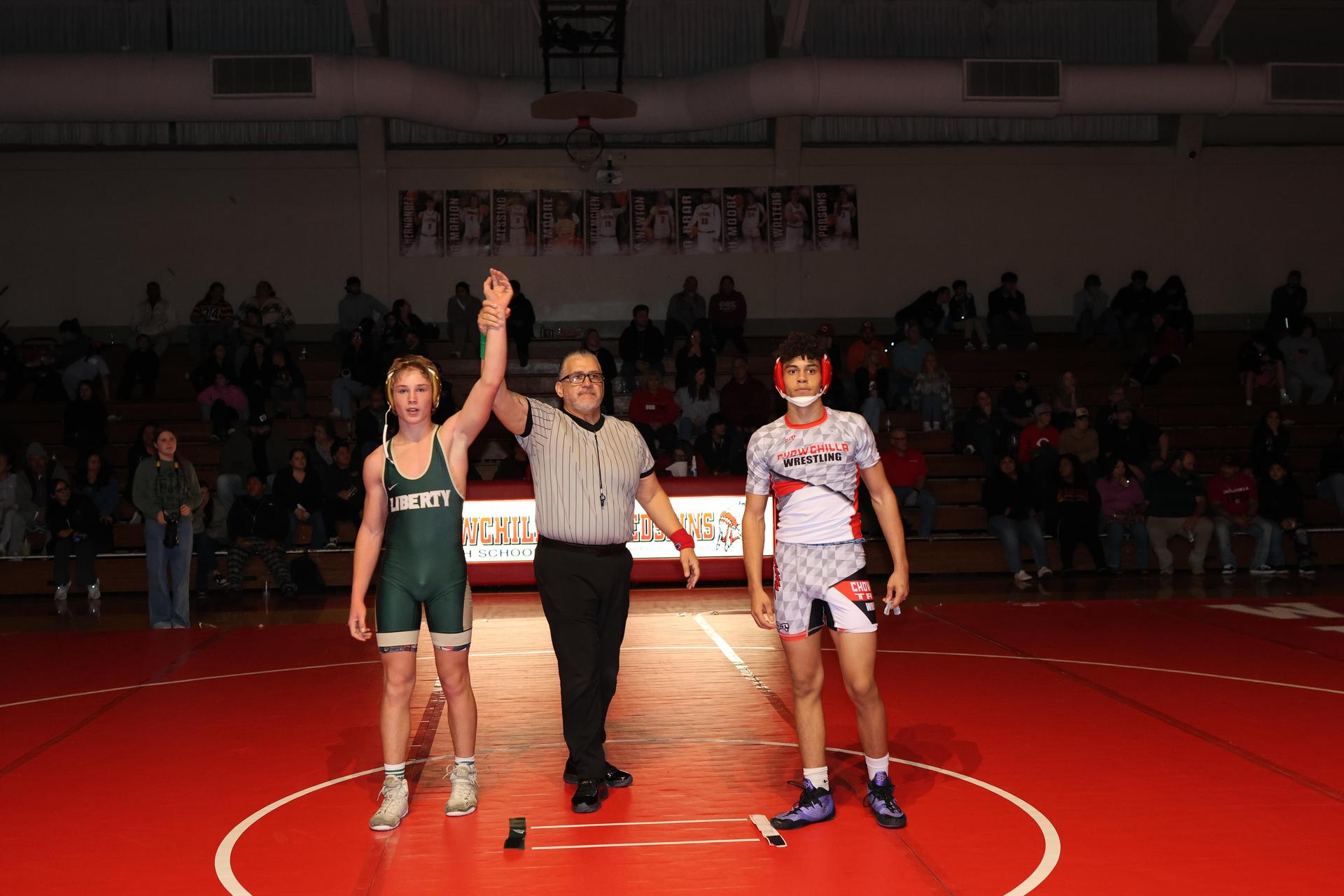 Wrestling winners with hands up 91