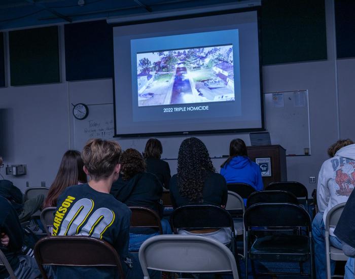 students look at slide