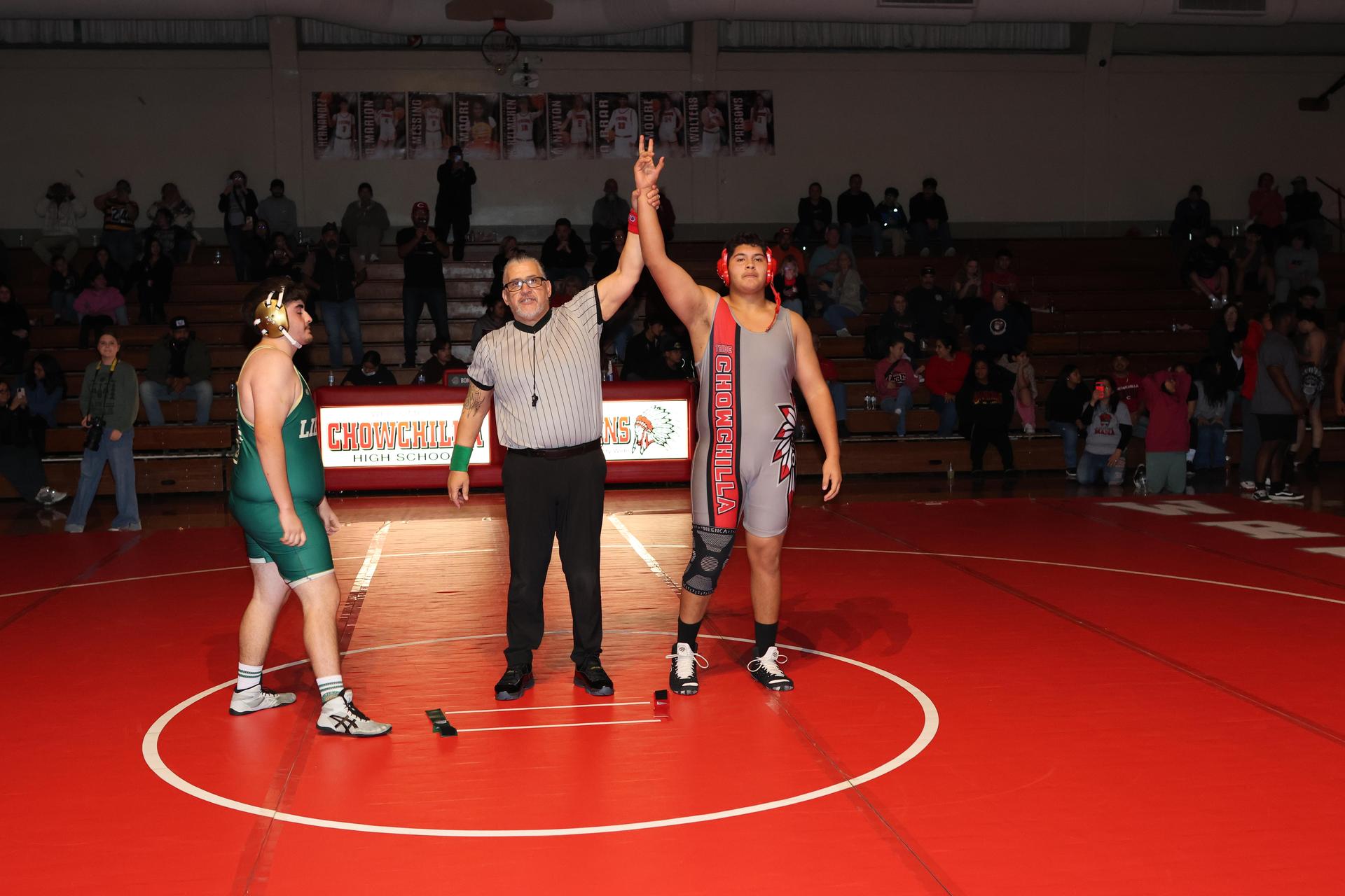 Wrestling winners with hands up 133