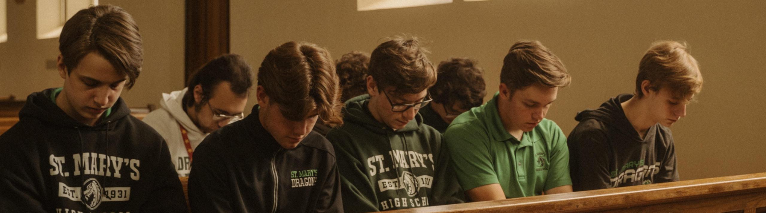 Students pray in the Holy Family Chapel