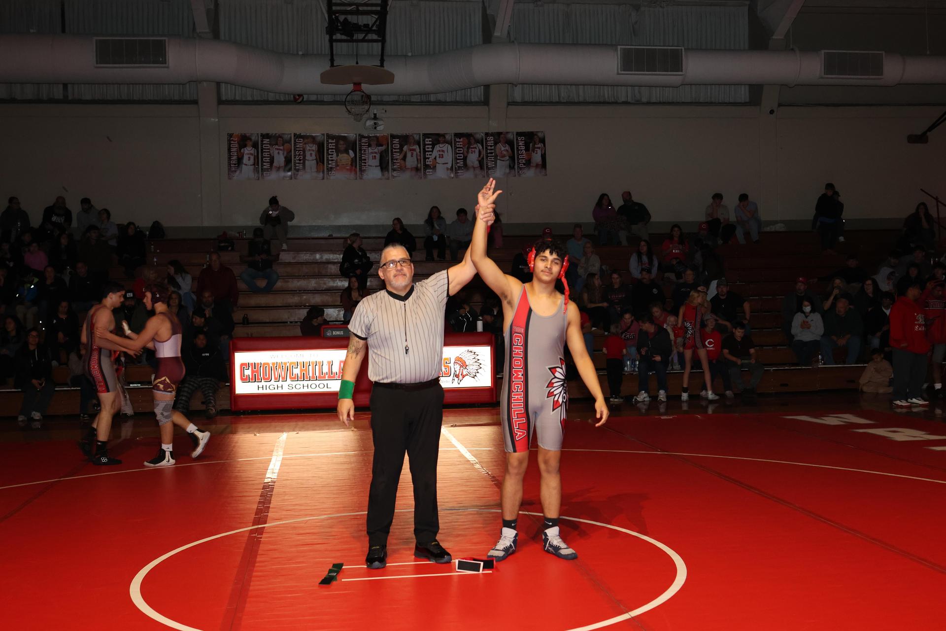 Wrestling winners with hands up 38