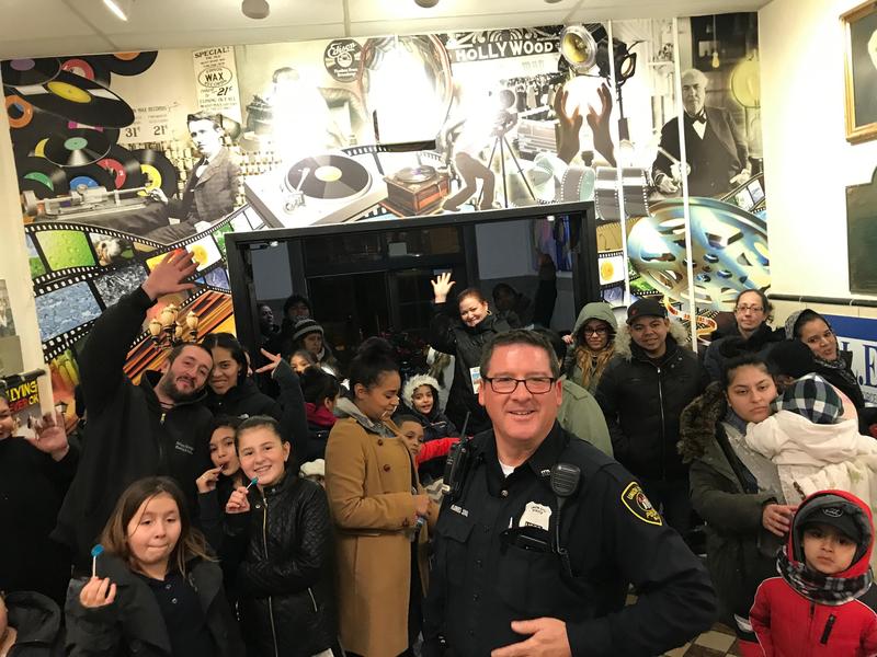 UC PO Flores with the parents and children entering Edison school