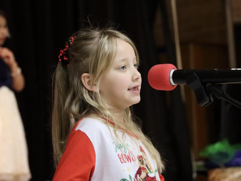 Student talking on a microphone