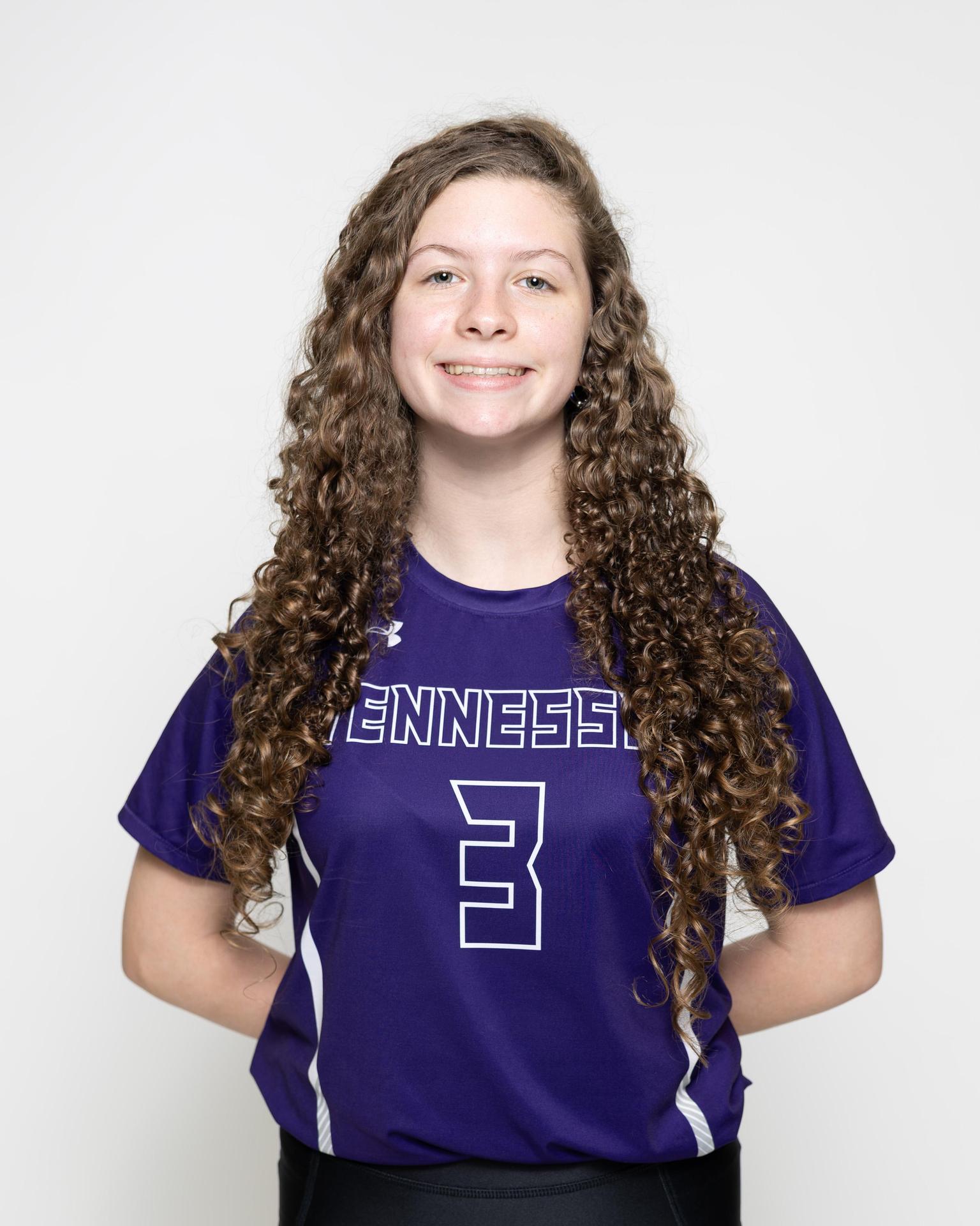 number 4 female volleyball player posing 