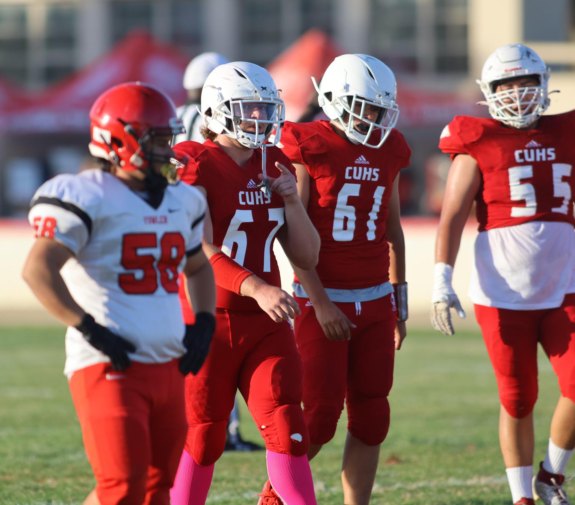 junior varsity football players in action against Fowler