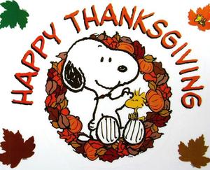 snoopy and woodstock in the center of a fall wreath. Happy thanksgiving written on top