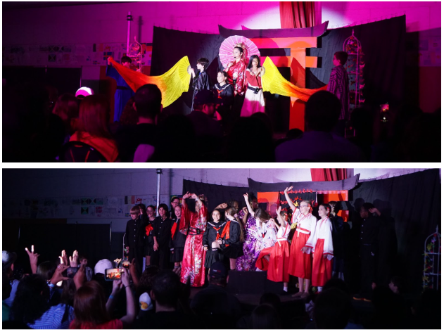 Students wave bright banners; fifth grade students wave on stage following their final performance