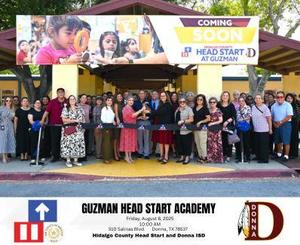 Guzman Red Ribbon Photo of Family members, HCHSP staff and community reps