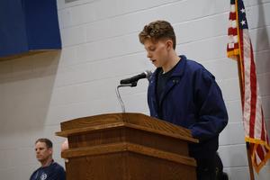 A student reads the History of Memorial Day