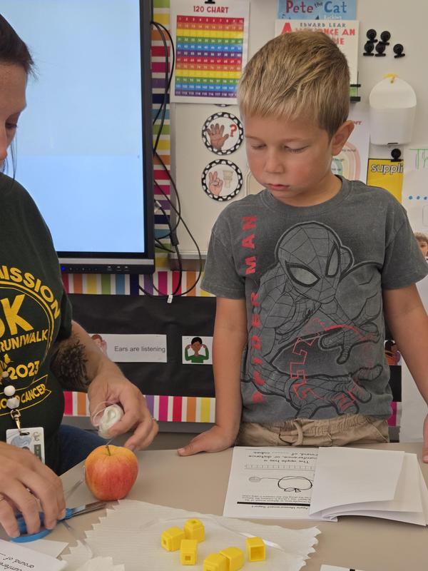 Students help find the prized apple