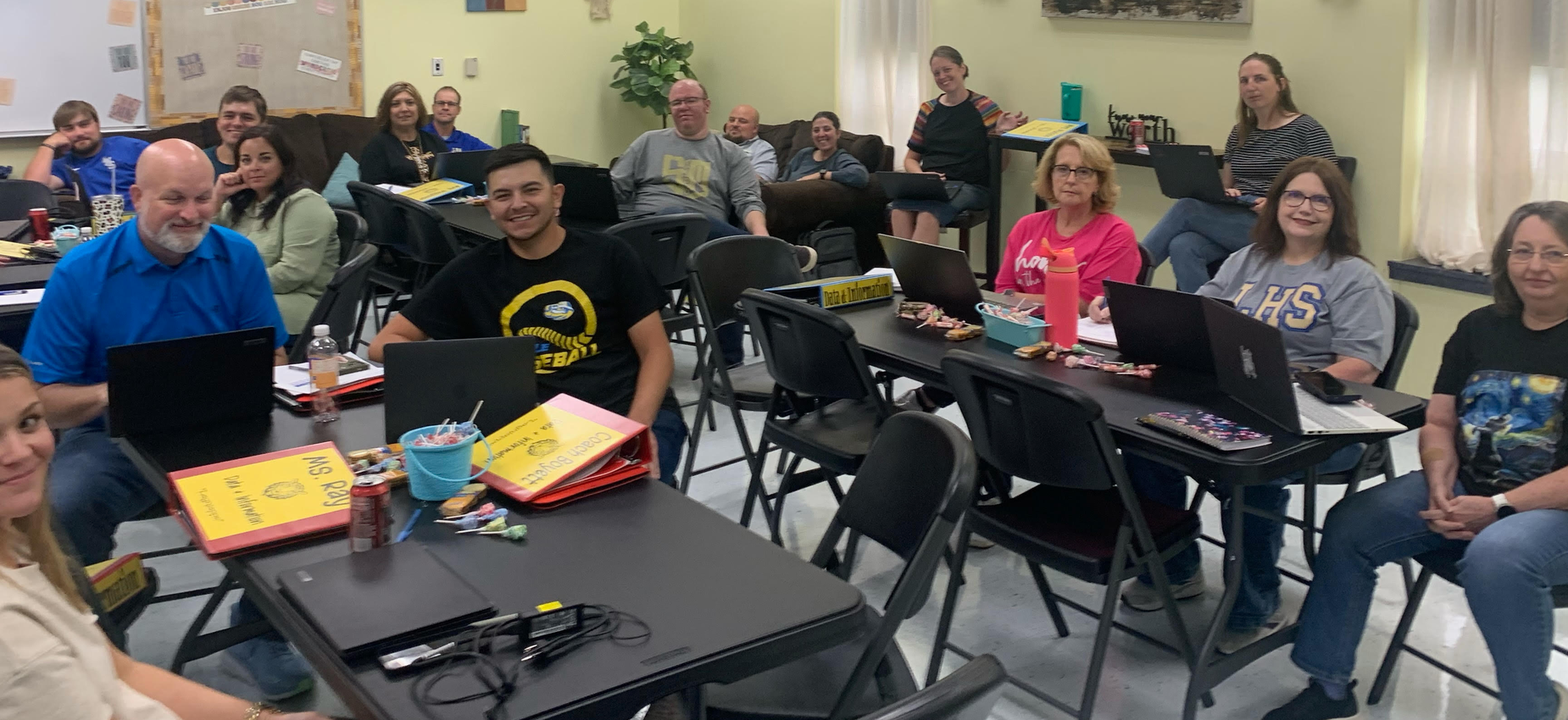 Smiling People Sitting in Desks