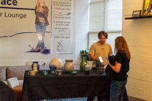 Student Selling his artwork
