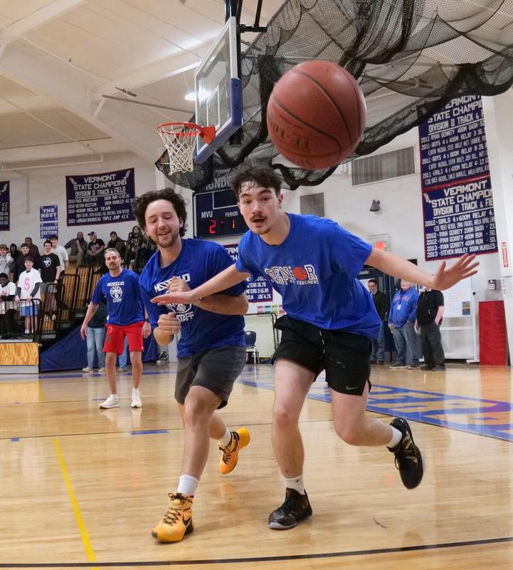 Students and Staff playing basketball