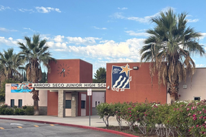 Arroyo Seco Junior High School exterior with palm trees and blue skies