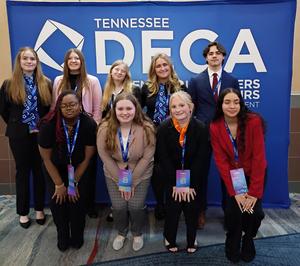 Smiling group of students, some with awards
