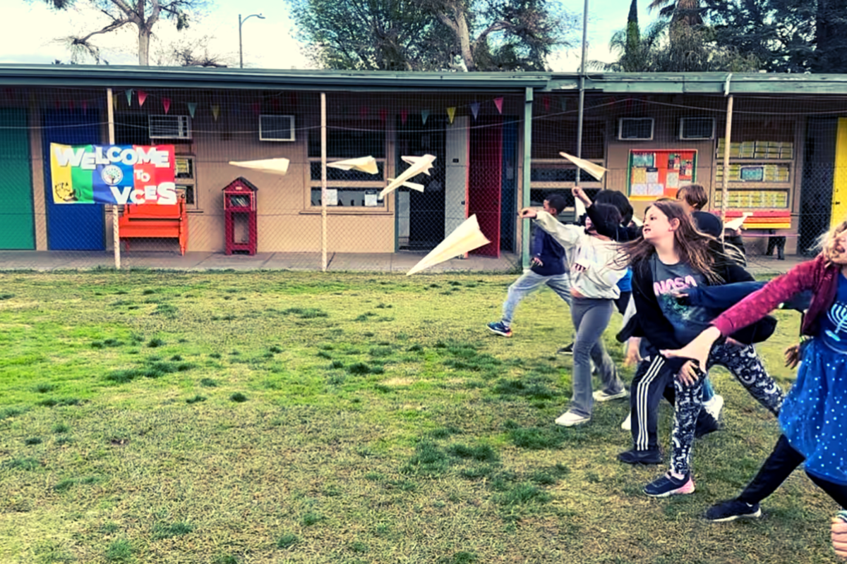 Students fly paper airplanes with wing variations