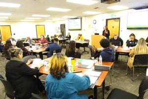 Members of the School Consolidation Advisory Committee meet in the District Board Room.