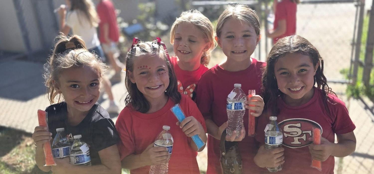 Students enjoying popsicles after Jog a Thon