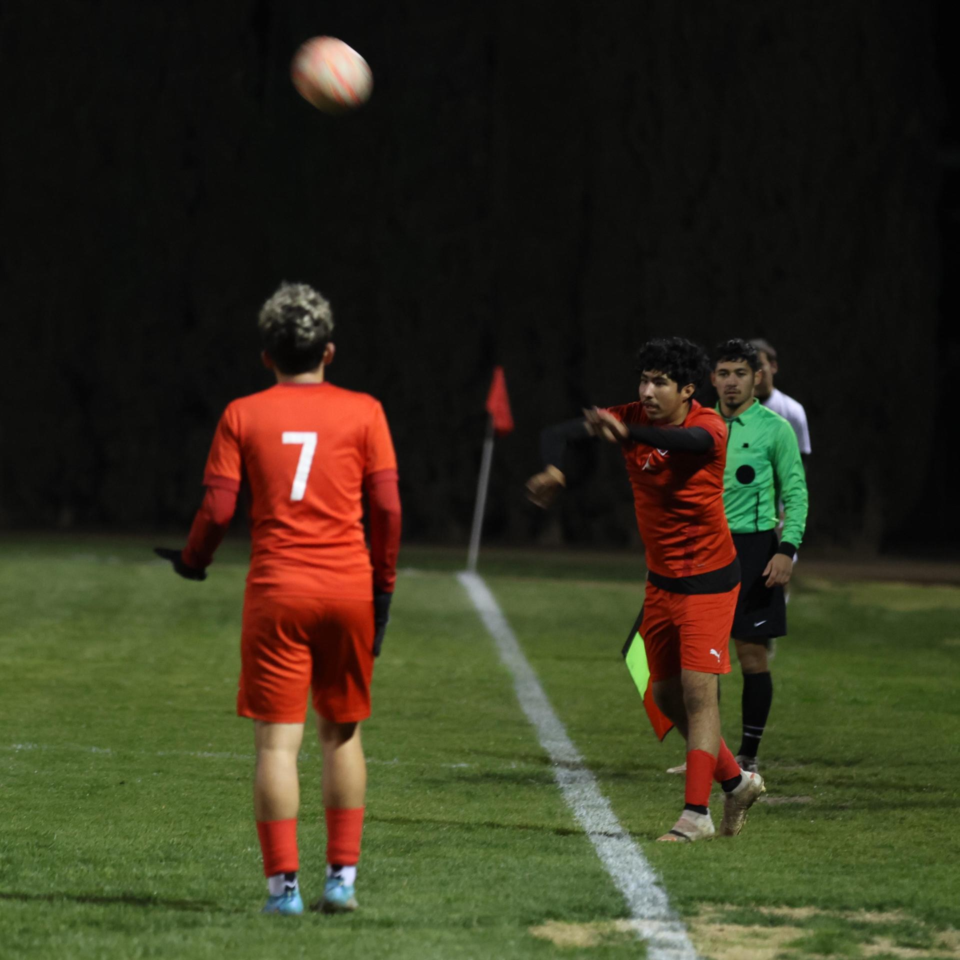 varisty boys soccer playing against yosemite
