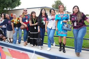 PTA moms watching the Hispanic Heritage Celebration